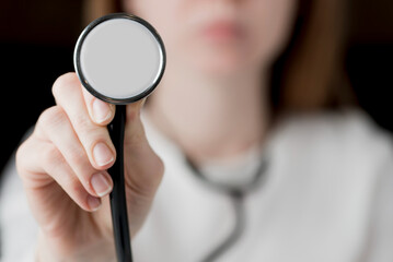 Close-Up Medical Examination: Female Doctor with Stethoscope