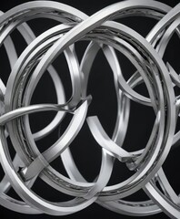 Symmetrical pattern of intertwined metal rings in silver tone, ornamental, linked, interconnected