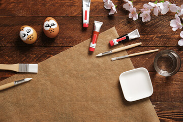 Painted eggs in the form of owls. Preparation for Easter celebration. Painting Easter eggs with...