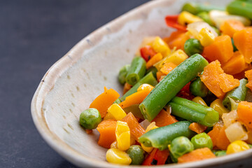 Mexican Mix of Vegetables. Tomatoes, Green Beans, Peas, Corn. Dietary Food.Bright vegetable mix .Vegetarian food.Assorted.