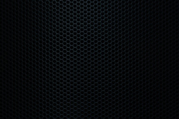 Naklejka premium Black grid background macro,Speaker grille texture,Black speaker macro background,Speaker grille texture,Black iron speaker grid texture. Industrial background.