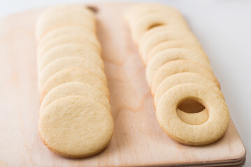 Baked shortbread cookies from the oven laid out on a wooden board