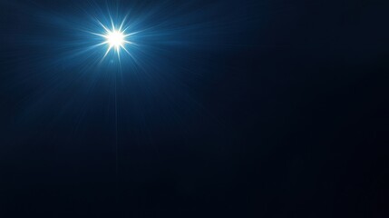 Obraz premium A stunning blue starburst effect on a dark background.