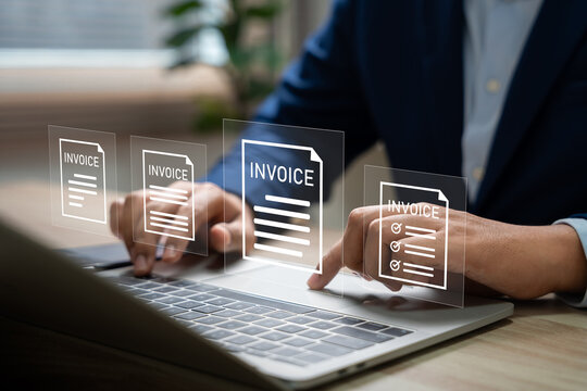 E-Invoice and Digital billing concept, Businessman using laptop to manage electronic statements on virtual screen. E-tax, Digital receipt, Online invoice processing and tax accounting solutions.