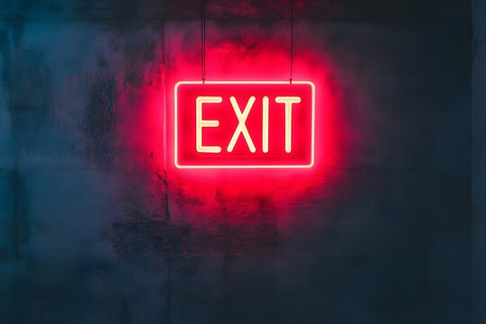 Glowing red neon exit sign illuminated on dark background. Emergency escape route indicator. Urban nightlife, safety guidance in buildings. Moody atmosphere.
