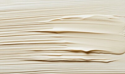 Creamy beige texture, swirled strokes, background smooth, cosmetic product