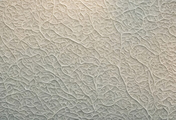 Intricate relief sculpture on neutral background.