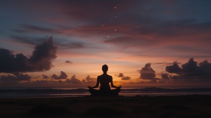 A person meditating on the beach during a colorful sunset with clouds and stars.