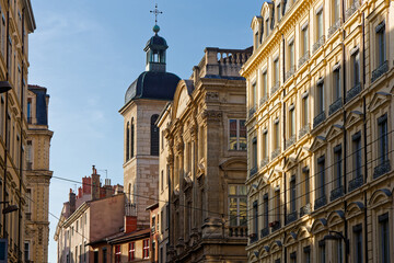 Fototapeta premium The bell tower of the church of Saint-Pierre des Terreaux, currently attached to the Palais Saint Pierre and houses the 19th century and 20th century sculptures of the Museum of Fine Arts.