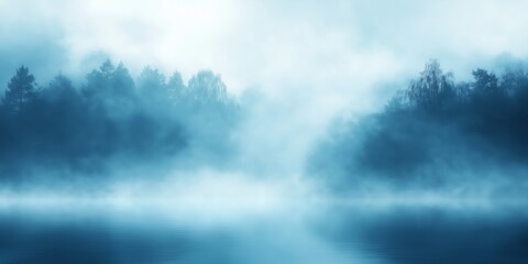 Fototapeta premium Ground-level mist envelops a tranquil landscape in cool blue tones creating a serene and mysterious atmosphere