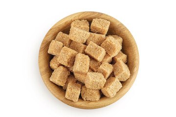 brown sugar in a wooden bowl isolated on white background. Top view. Flat lay