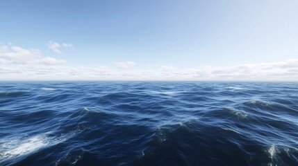 Fototapeta premium A serene view of ocean waves gently rolling under a clear blue sky.