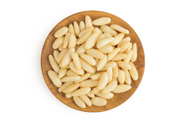 Shelled European pine nuts in wooden bowl isolated on white background with full depth of field....