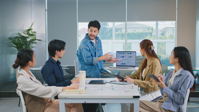 Ux Developer and Ui Designer brainstorming and Startup marketing team businesspeople discussion in office. Teamwork, Strategy, digital marketing Strategy Development User experience concept. - Powered by Adobe