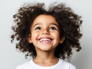 A Radiant Child's Joy: A Bright Smile and Sparkling Eyes Capture the Essence of Happiness and Carefree Innocence.