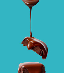 Creative layout made of bar of chocolate on the blue background. Flat lay. Food concept.  Melted chocolate on the blue.