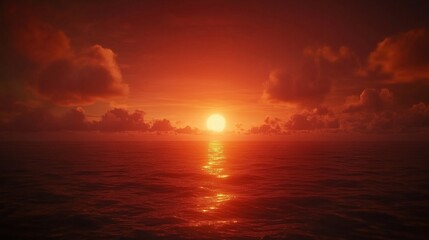 Obraz premium A breathtaking sunset illuminating the ocean with vibrant orange and red hues.
