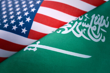 Background of the flags of the USA and saudi arabia. The concept of interaction or counteraction...