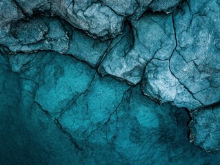 Aerial View of Rocky Coastline with Clear Turquoise Water and Underwater Rock Formations