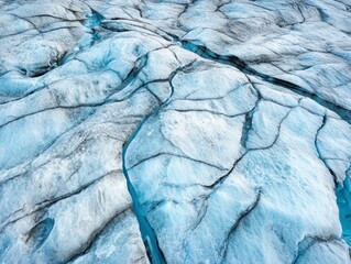 Aerial View of Cracked Ice and Turquoise Meltwater in a Frozen Landscape