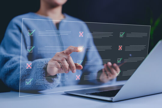 Online survey and digital checklist concept. Woman interact with checklist interface on laptop, with checkmarks and cross symbols. online forms, surveys, exams, and decision-making. questions test,