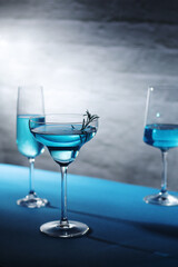 Glasses with blue alcohol cocktail ready for a party