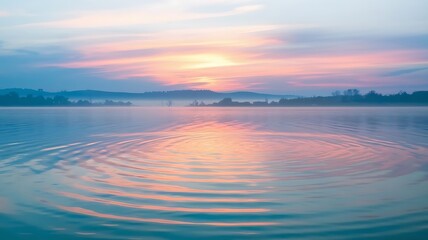 Fototapeta premium Serene water ripple with soft sunset reflection, creating a calming, tranquil atmosphere. Perfect for nature, relaxation, and meditation themes.