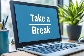 Work-Life Balance Reminder: A laptop displays a motivational message "Take a Break," symbolizing the importance of rest and rejuvenation amidst a busy workspace. 