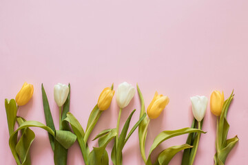 Naklejka premium Colorful bouquet of flowers tulip on a pink background, copy space, woman day