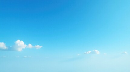 Fototapeta premium Serene Blue Sky Canvas with Delicate Puffy Clouds A Peaceful, Tranquil Atmospheric Image