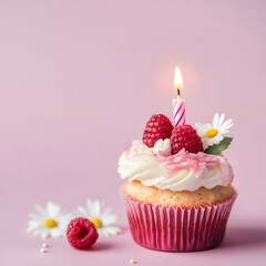 Birthday cupcake with candle and delicious fruit filling with fresh raspberries on pink background.