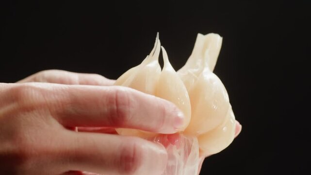 Whole fermented garlic, Marinated salted Ferment, pickled vegetables, healthy super food, close up macro of garlic. 