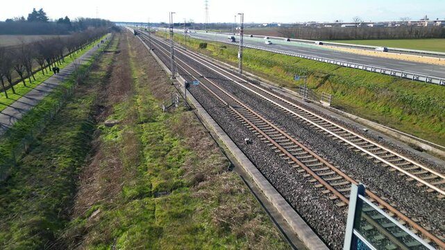 Europe, Italy , Milan - Frecciarossa  Hight speed 300km h train railway from Milan  to Turin  view from the drone - the faster way to travel in Italy for tourist and passengers - tourist destination 
