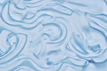 The texture of the cosmetic gel on the blue background.