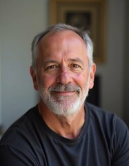 Obraz premium A mature man with gray hair, resident of USA, smiles gently. The warm lighting creates a cozy atmosphere. Calm, confident look. Experience, professionalism and intelligence in the eyes. Generative AI