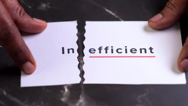 Paper with text cut to illustrate inefficiency concept