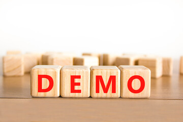 Demo symbol. Concept word Demo on beautiful wooden blocks. Beautiful wooden table white background....