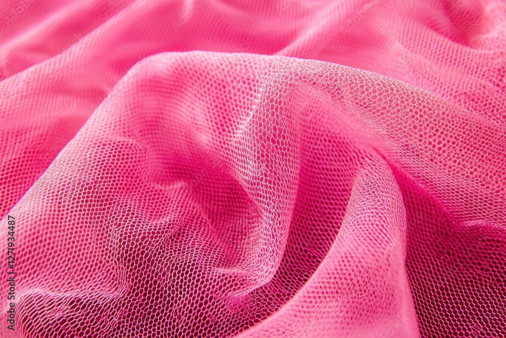 Poster a close-up of textured pink tulle fabric, showing delicate folds and a fine mesh pattern that create