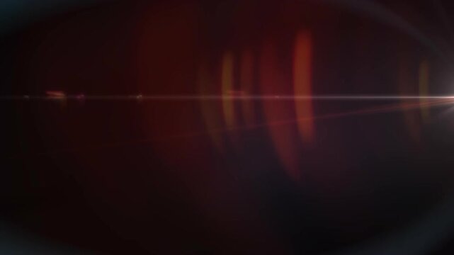 Warm light lens flare transitioning smoothly on dark background