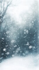 Gentle snowfall with blurred trees creates a winter wonderland scene