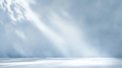 Fluffy white clouds drift across a bright blue sky above a cascading mountain waterfall