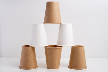 Eco-friendly disposable paper tableware. Paper cup, wooden forks, recycling. Copy space
