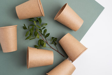 Eco-friendly disposable paper tableware. Paper cup, wooden forks, recycling. Copy space
