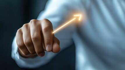 A man is pointing to an arrow on his shirt