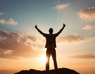 Fototapeta premium silhouette of a man with arms raised