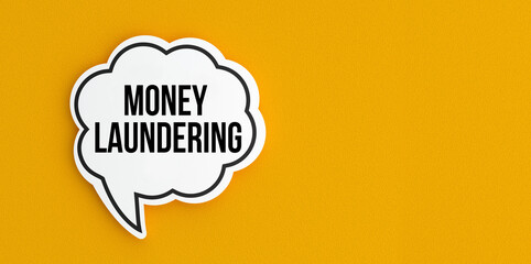 Money laundering text message on speech bubble.