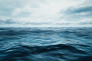 Fototapeta premium Calm ocean waves under cloudy sky during the day