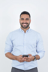Confident Emirati Businessman with Smartphone in Professional Studio Setting