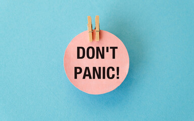 A pink paper with the words Don't Panic written on it