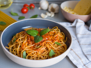 Balanesi pasta garnished with fresh basil leaves highlights rich colors and textures. Delicious Balanesi pasta sits on plate, capturing essence of authentic cuisine Balanesi pasta presentation 